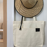 Everywhere tote bag on hook with sun hat