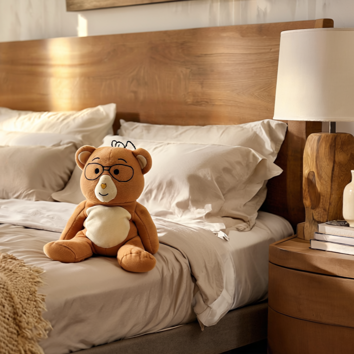 Bear sitting on bed