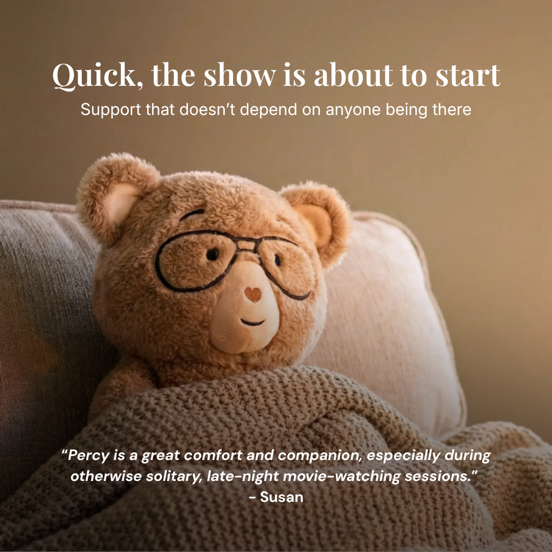 Teddy bear wearing glasses on a couch with a quote about comfort and companionship.