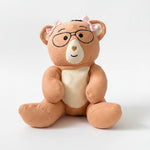 Plush Penny bear with glasses and pink bows on a white background