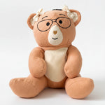Plush Penny weighted bear with glasses on a white background