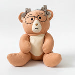 PlushPenny bear with glasses and a bow tie on a white background