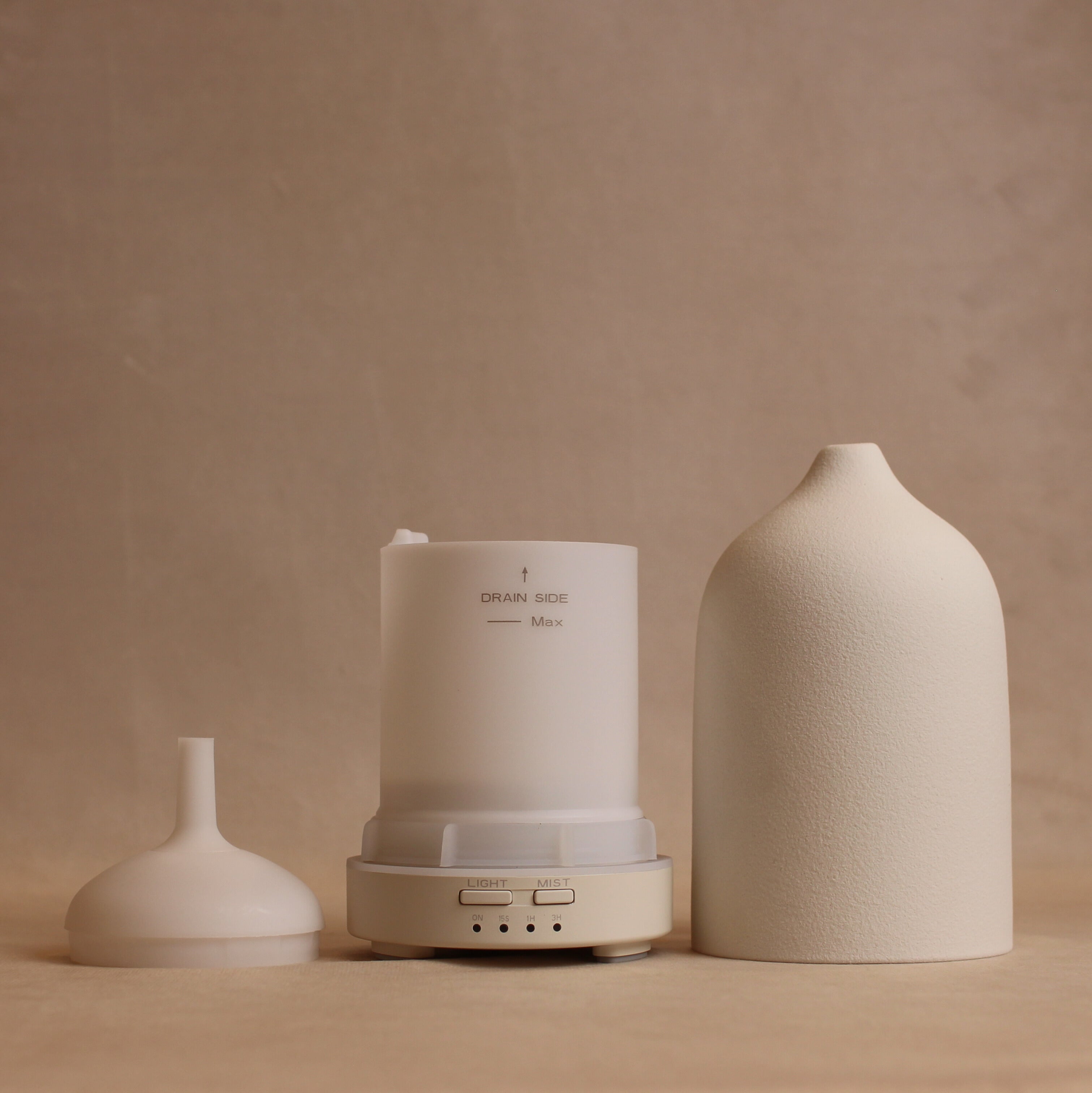 Front view of disassembled white keep calm diffuser