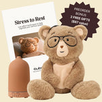 Percy bear with glasses, diffuser, and 'Stress to Rest' book on a light yellow background