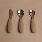 Over head view of toddler silverware in oat