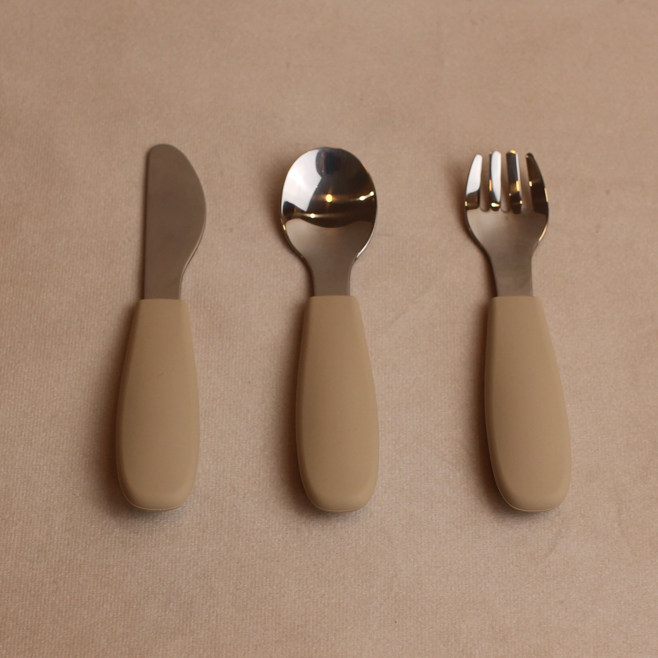 Over head view of toddler silverware in oat