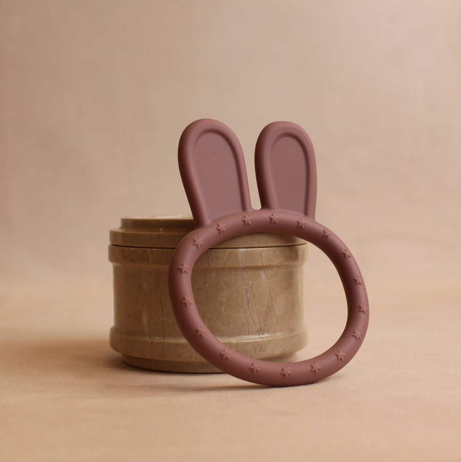 Front view of silicone rabbit teether in blush