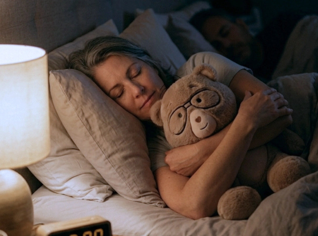 Woman sleeping in bed with Percy 5 lb. comfort bear.