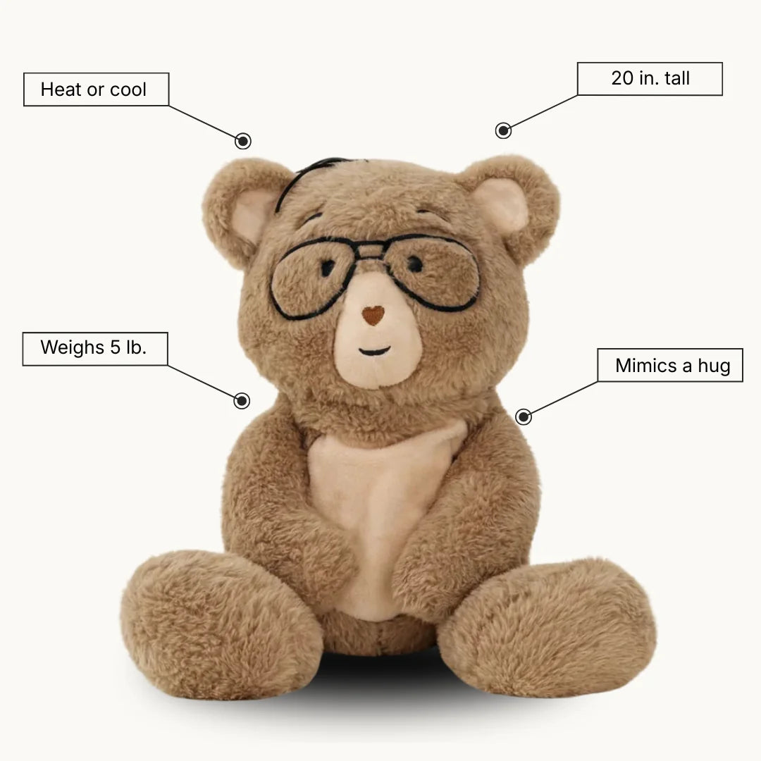 Percy bear with features labeled on a white background - "heat or cool" "20 in. tall" "Mimics a hug" "Weighs 5 lb."