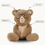 Percy bear with features labeled on a white background - "heat or cool" "20 in. tall" "Mimics a hug" "Weighs 5 lb."